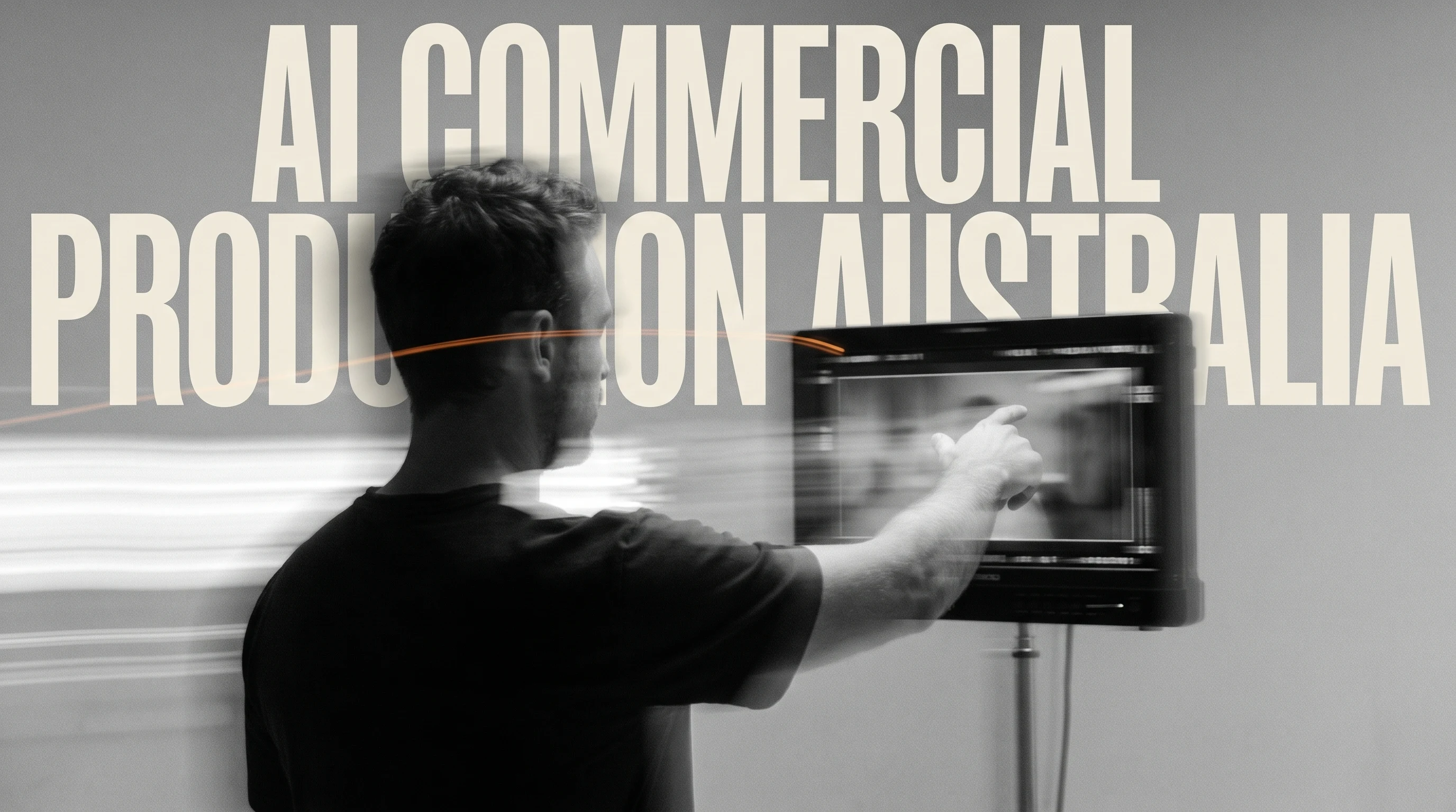 A film director mid-gesture pointing at an unbranded production monitor on a minimal studio set, three-quarter framing from behind