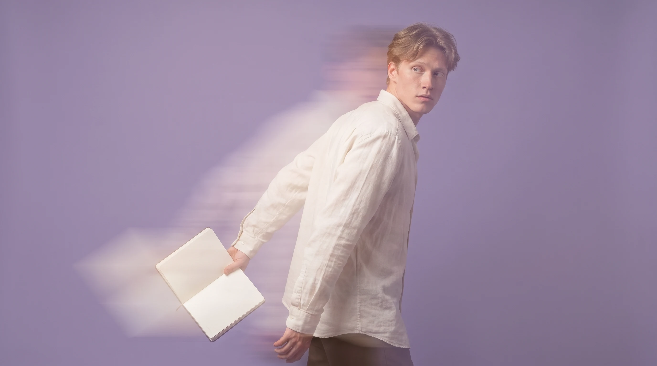 A person mid-step across a lilac studio, glancing back over one shoulder with an open notebook held loosely at their side, wearing a relaxed linen