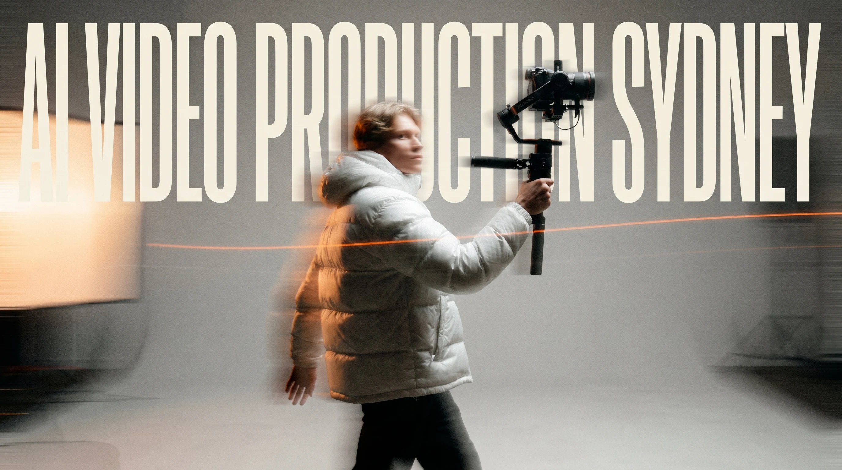 Videographer mid-stride through an open studio, gimbal rig raised in one hand, glancing back over their shoulder toward an off-frame light source