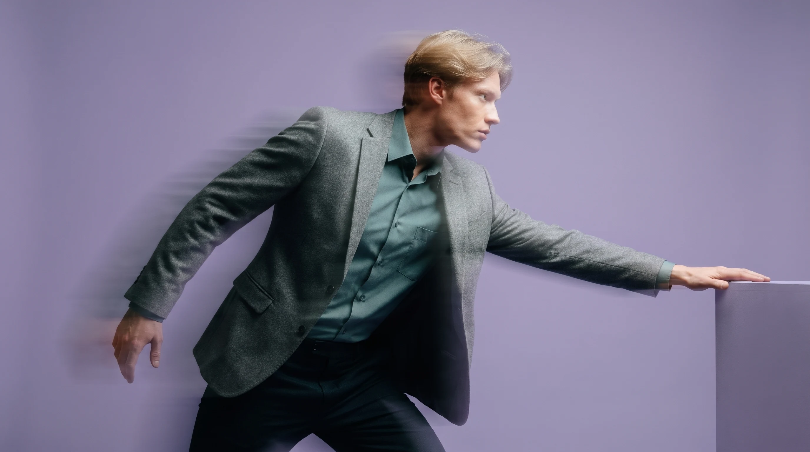 a person in a lilac studio mid-reach toward an off-frame surface, slightly different casual-professional outfit, low three-quarter angle, confident