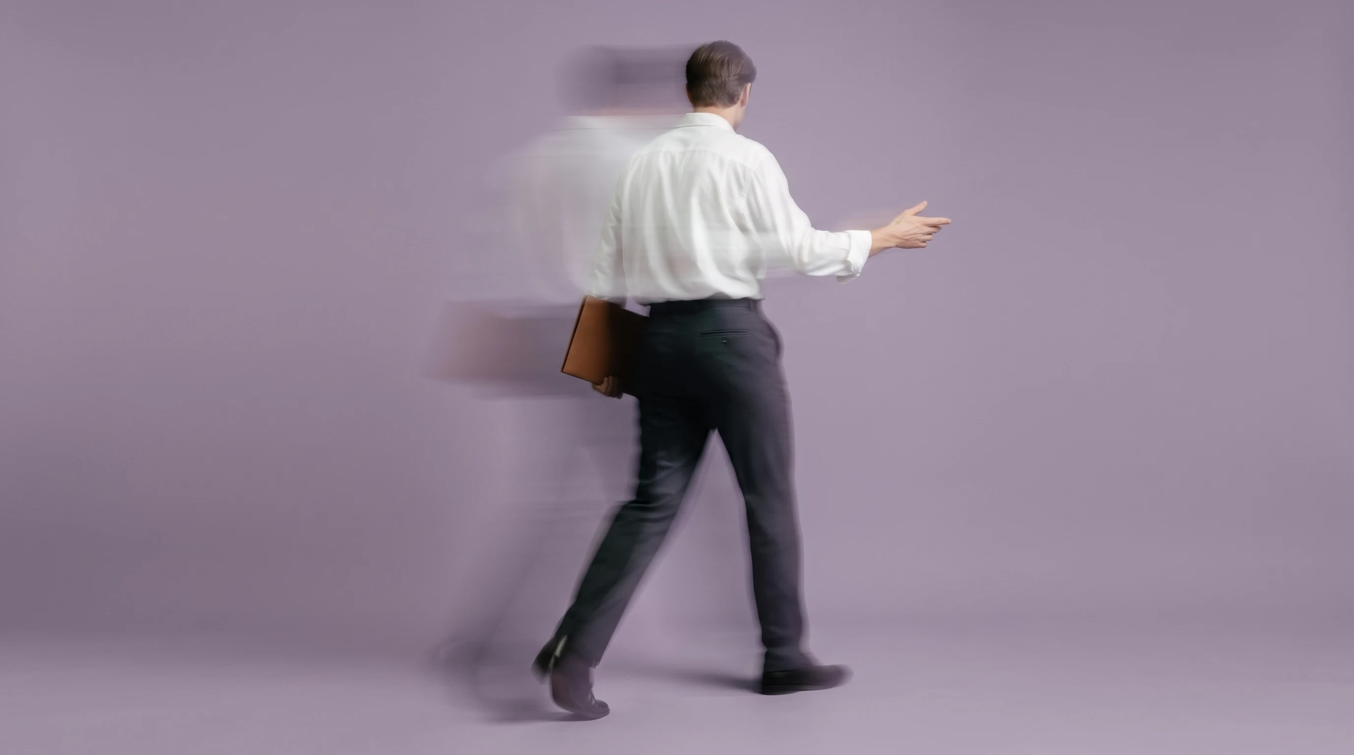 a person mid-step walking through frame from behind, carrying a slim folder tucked under one arm, free hand gesturing outward, lilac studio backdrop,